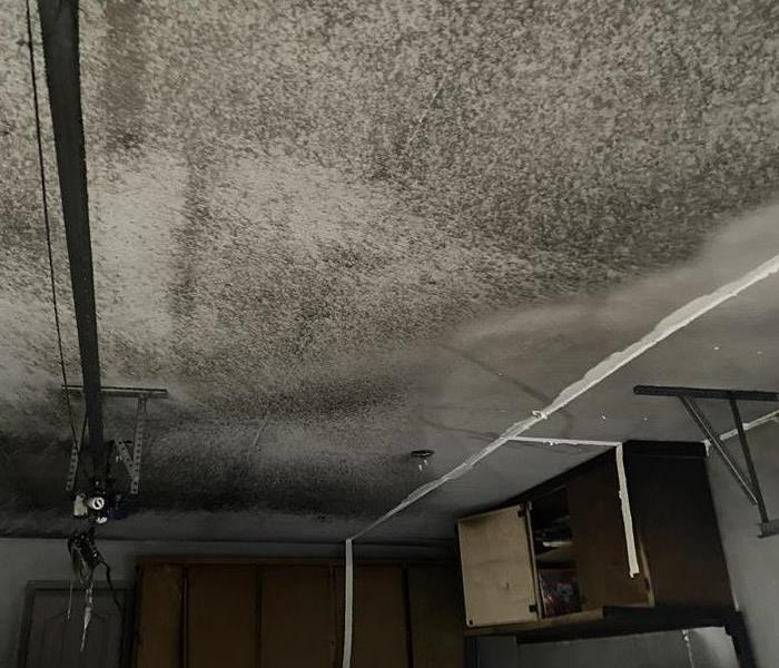 Smoke and Soot damage to the ceiling in this garage in Fayetteville